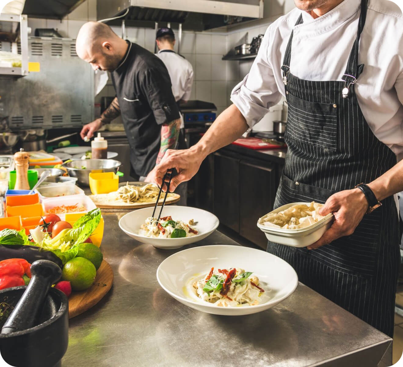 a group of chefs are cooking